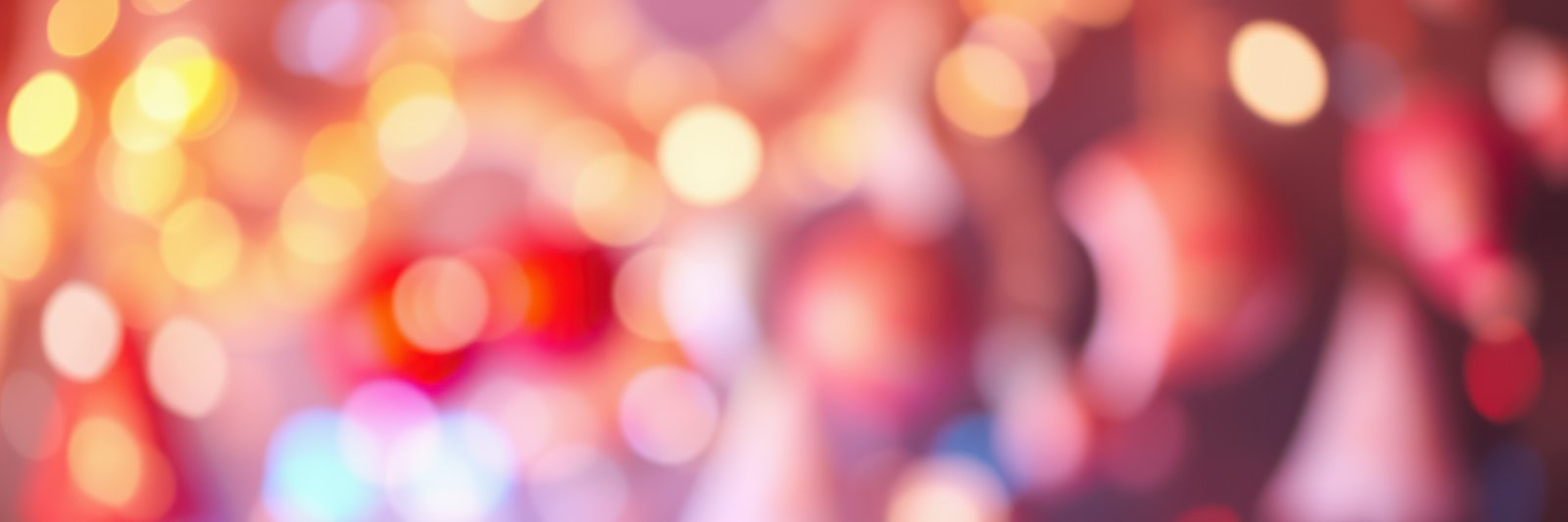 Festive gathering with vibrant lights and blurs creating a joyful atmosphere in the evening